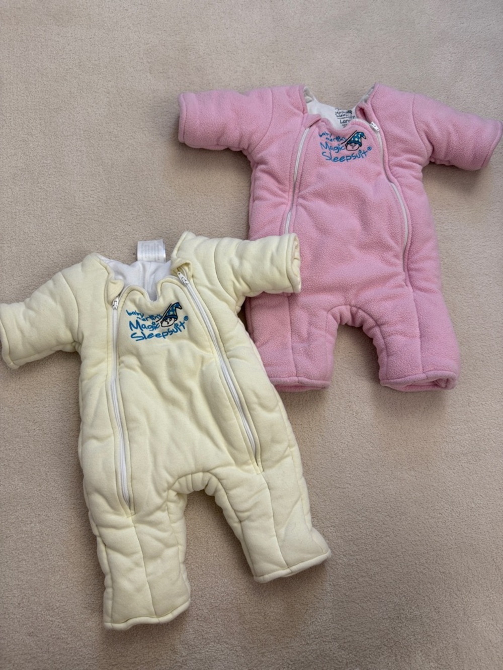Lot of 2 Baby Merlin's magic sleepsuit small & large